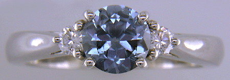 Montana Sapphire set with two round diamonds in a hand-crafted platinum ring.
