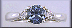 Montana Sapphire set with two round diamonds in a hand-crafted platinum ring.