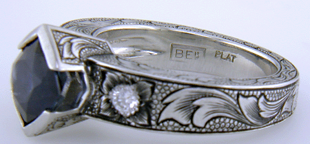 Close-up of Bijoux Extraordinaire hallmark (BEL).