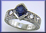 A Montana Sapphire set with diamonds in a beautifully hand-engraved platinum ring.