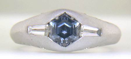 Hand-crafted Montana Sapphire and baguette diamond ring crafted in platinum. (J8433)