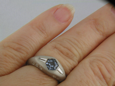 Hand-crafted Montana Sapphire and baguette diamond ring crafted in platinum. (J8433)