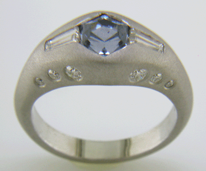 Hand-crafted Montana Sapphire and baguette diamond ring crafted in platinum.