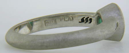 Close-up of Bijoux Extraordinaire hallmark (BEL).