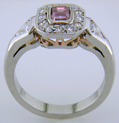Side view of hand-crafted platinum ring with Purplish-Pink diamond. (J7260)