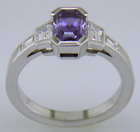 Side view of Purple sapphire and diamond hand-crafted platinum ring.