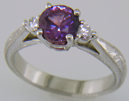 Purple Sapphire set with two round diamonds in a hand-engraved platinum ring. (J8525)