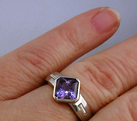 Purple sapphire and diamond hand-crafted platinum ring.