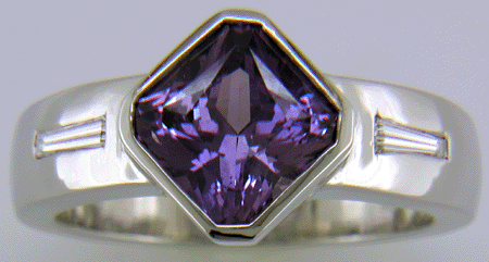 Purple sapphire and diamond hand-crafted platinum ring.