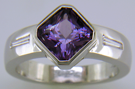 Purple sapphire and diamond hand-crafted platinum ring.