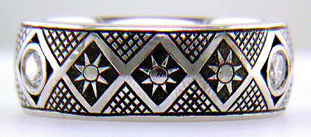 Hand engraved Pysanky ring with diamonds.