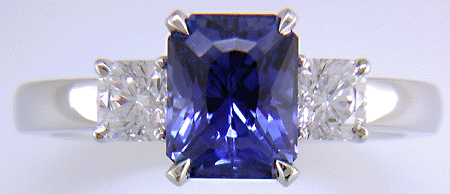 A hand-crafted platinum ring with a sriking Radiant-cut Sapphire and two sparkling Flanders-cut diamonds.
