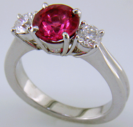 A Red spinel set with two ideal-cut diamonds in a beautiful platinum ring.