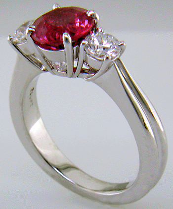 A Red spinel set with two ideal-cut diamonds in a beautiful platinum ring.