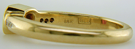 Close-up fo Bijoux Extraordinaire hallmark (BEL).