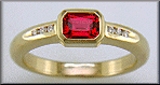 Emerald-cut Red Spinel set with round brilliant-cut diamonds in a hand-crafted ring. (J6776)