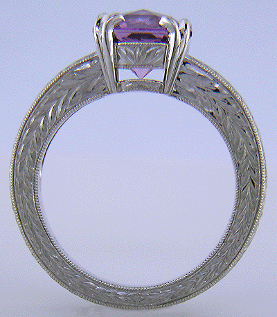 Lavender spinel set with sparkling lilac sapphires in a beautifully hand-engraved platinum ring.