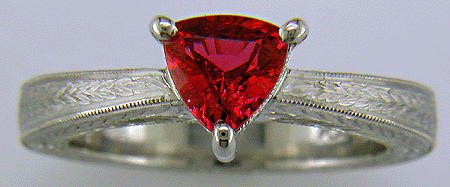Hand engraved platinum ring with a trillium red spinel.
