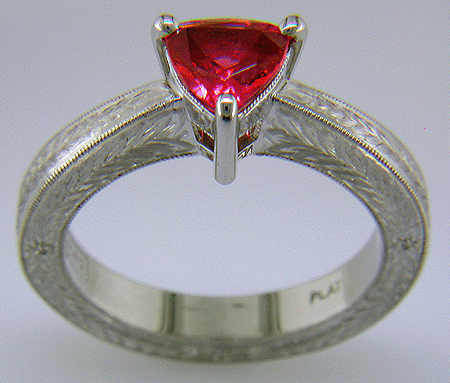 Hand engraved platinum ring with a trillium red spinel.