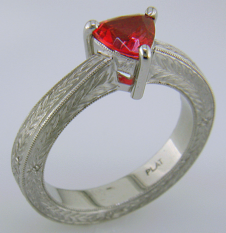 Hand engraved platinum ring with a trillium red spinel.