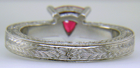 Hand engraved platinum ring with a trillium red spinel.