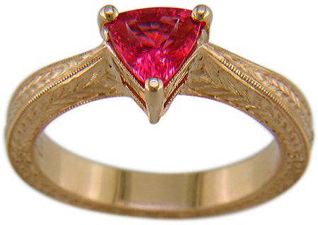 Hand engraved rose gold ring with a trillium red spinel.