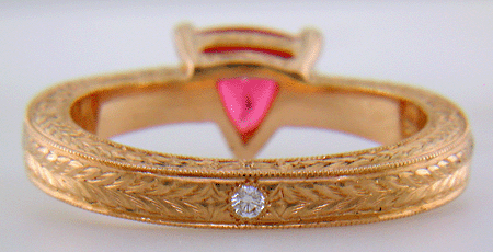 Inside view of hand engraved rose gold ring with a trillium red spinel.