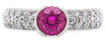 Pink sapphire and pav-set diamonds platinum ring.