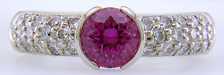 Pink sapphire and pave-set diamonds platinum ring.