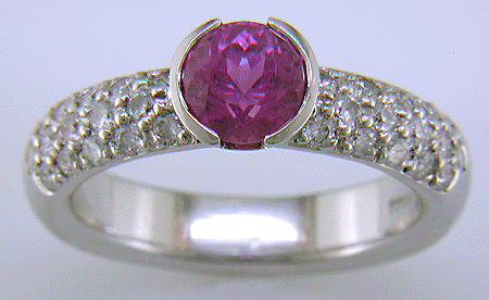Pink sapphire and pave-set diamonds platinum ring.