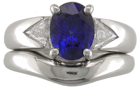 Sapphire and trilliant diamond engagement ring custom designed in platinum with matching wedding band.