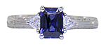 Sapphire and trilliant diamond platinum hand engraved engagement rings. (J8423)