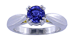 Platinum sapphire ring with two hidden diamonds and 18kt gold accents.