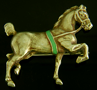 Sloan & Co. horse brooch with green enamel accent. (J9114)