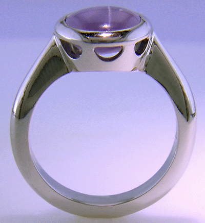 Side view 0f Purple star sapphire ring hand crafted in platinum.