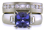 Custom tanzanite and diamond engagement ring and wedding band.