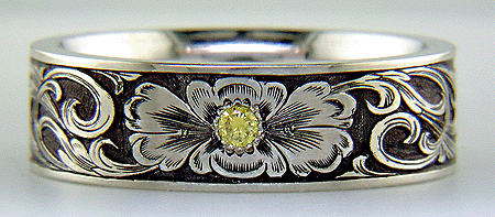 Hand engraved band set with yellow diamond.