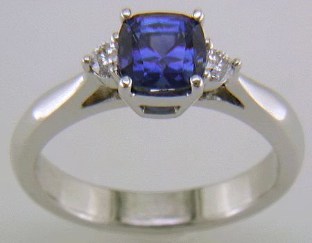 Square Cushion-cut Sapphire set with two round diamonds in a hand-crafted platinum ring. (J8599)
