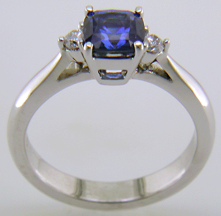 Square Cushion-cut Sapphire set with two round diamonds in a hand-crafted platinum ring. (J8599)