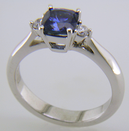 Square Cushion-cut Sapphire set with two round diamonds in a hand-crafted platinum ring. (J8599)