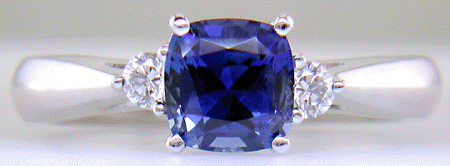 Square Cushion-cut Sapphire set with two round diamonds in a hand-crafted platinum ring. (J8599)