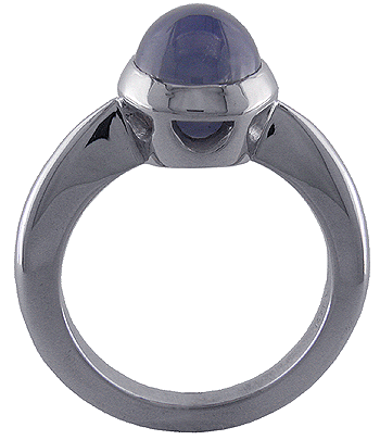 Side view of star sapphire and white gold engagement ring