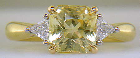 Square-radiant-cut Yellow Sapphire set with two brilliant-cut diamonds in a hand-crafted 18kt gold and platinum ring. (J8711)