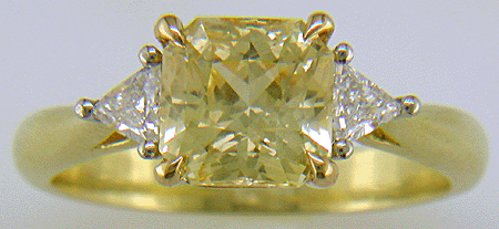 square-radiant-cut Yellow Sapphire set with two brilliant-cut diamonds in a hand-crafted 18kt gold and platinum ring. (J8711)