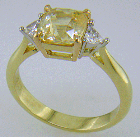 square-radiant-cut Yellow Sapphire set with two brilliant-cut diamonds in a hand-crafted 18kt gold and platinum ring. (J8711)