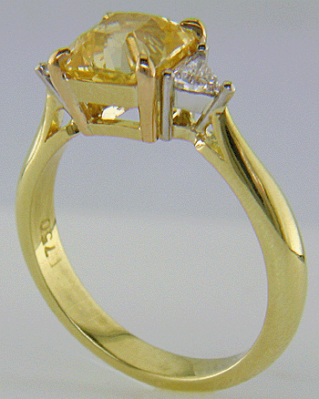 square-radiant-cut Yellow Sapphire set with two brilliant-cut diamonds in a hand-crafted 18kt gold and platinum ring. (J8711)