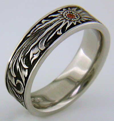 Hand engraved wedding band with Mandarin garnet