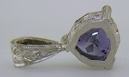 Rear view of trillium benitoite pendant accented with with four diamonds.