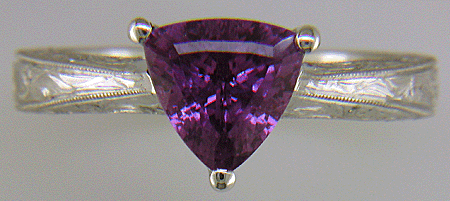 Hand-engraved platinum ring with a trillium purple sapphire. (J8732)