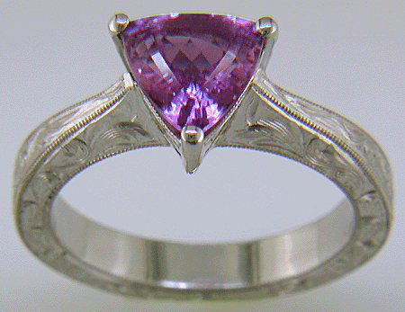 Hand-engraved platinum ring with a trillium purple sapphire. (J8732)